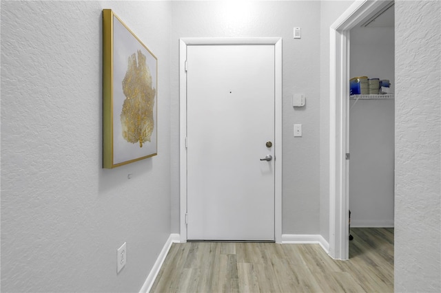 2402 W Azeele St Unit 423, Tampa, FL 33609 - doorway with wood finished floors and a textured wall
