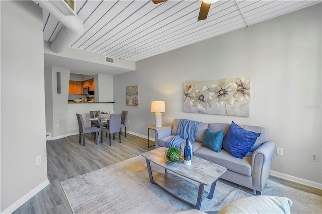 2402 W Azeele St Unit 423, Tampa, FL 33609 - living room with wood finished floors and ceiling fan