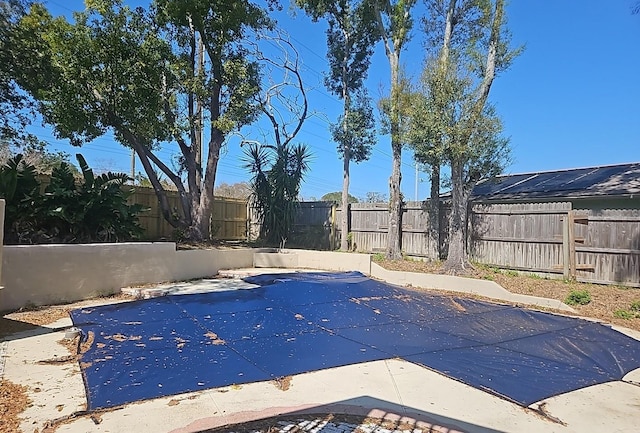 view of pool with a fenced in pool, a fenced backyard, and a patio