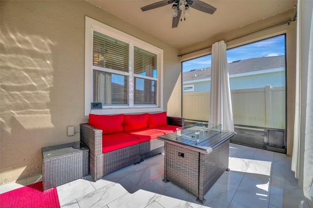 view of patio / terrace with an outdoor hangout area, a ceiling fan, and fence