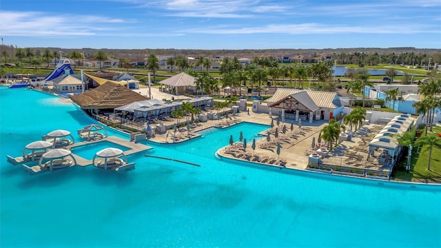 view of swimming pool featuring a water view and a water slide