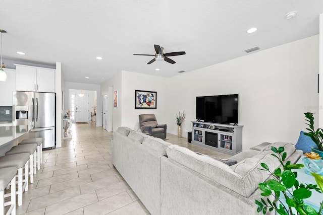 living room with light tile patterned floors, visible vents, recessed lighting, and ceiling fan