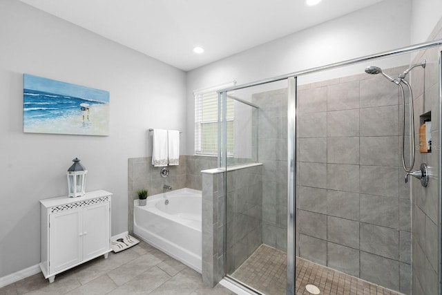 bathroom featuring a shower stall, baseboards, a garden tub, recessed lighting, and tile patterned floors