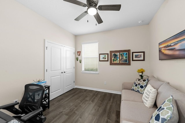 office area featuring baseboards, a ceiling fan, and dark wood-style flooring