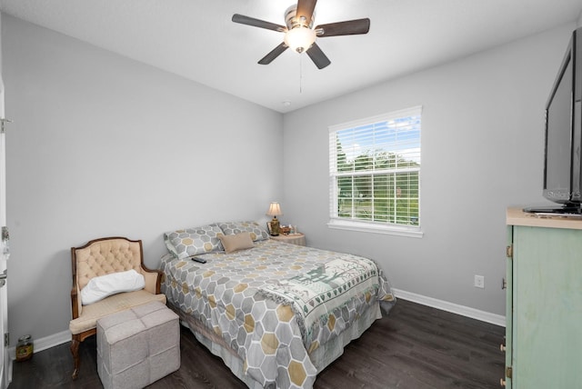 bedroom featuring dark wood finished floors, ceiling fan, and baseboards