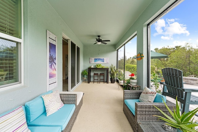 sunroom / solarium with ceiling fan