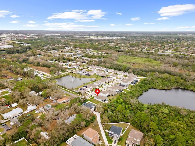 birds eye view of property featuring a water view and a residential view