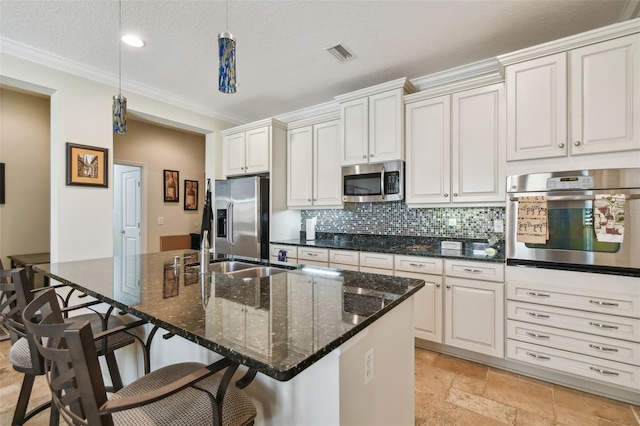 kitchen featuring tasteful backsplash, visible vents, a breakfast bar area, stainless steel appliances, and stone tile flooring