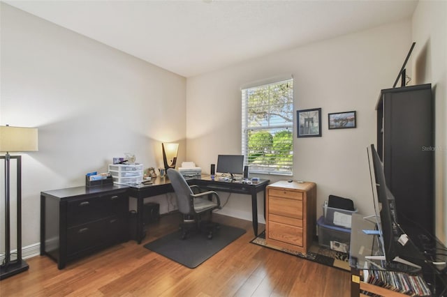 office featuring wood finished floors and baseboards