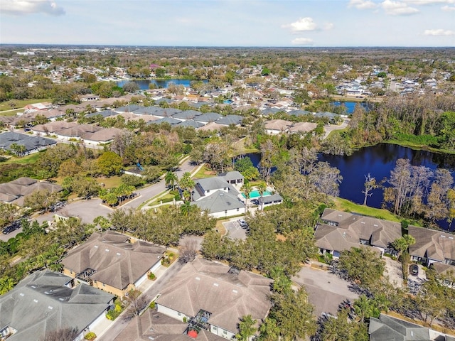 bird's eye view featuring a water view and a residential view