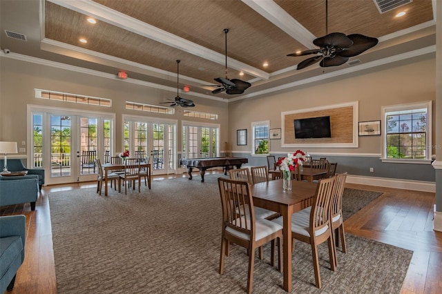 dining room featuring visible vents, wooden ceiling, wood-type flooring, crown molding, and french doors