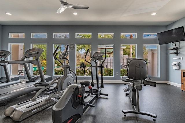 workout area with a healthy amount of sunlight, baseboards, a ceiling fan, and recessed lighting