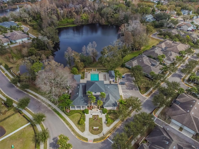 drone / aerial view featuring a residential view and a water view