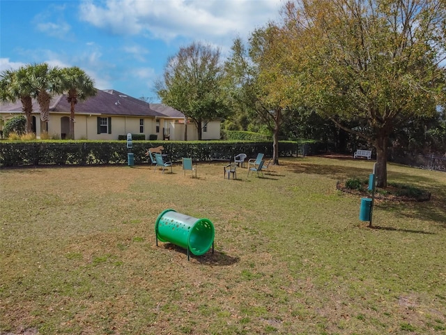 view of home's community with a lawn