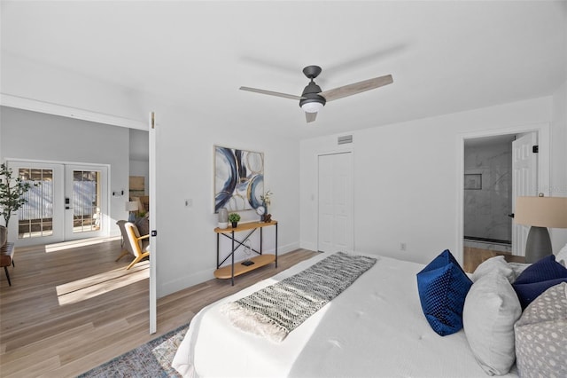 bedroom with french doors, a closet, a ceiling fan, wood finished floors, and baseboards