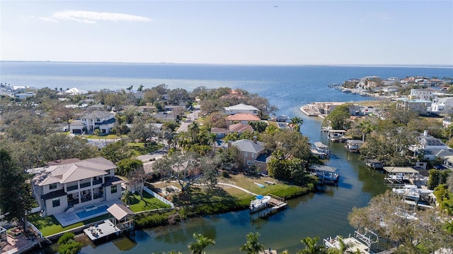 birds eye view of property with a water view and a residential view