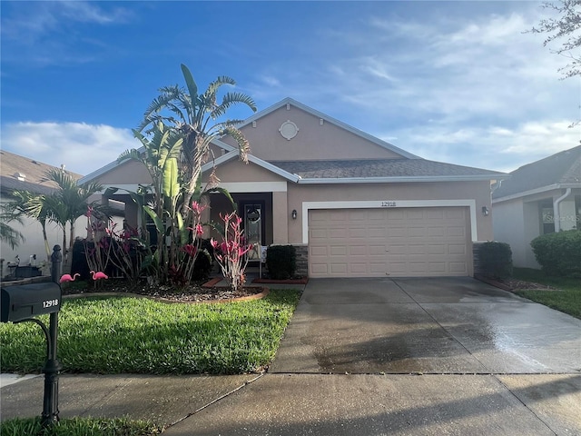 single story home with a garage, concrete driveway, and stucco siding