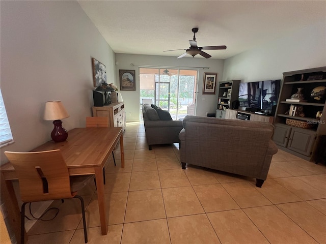 living room with ceiling fan and light tile patterned flooring