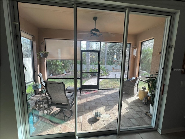 sunroom / solarium with ceiling fan