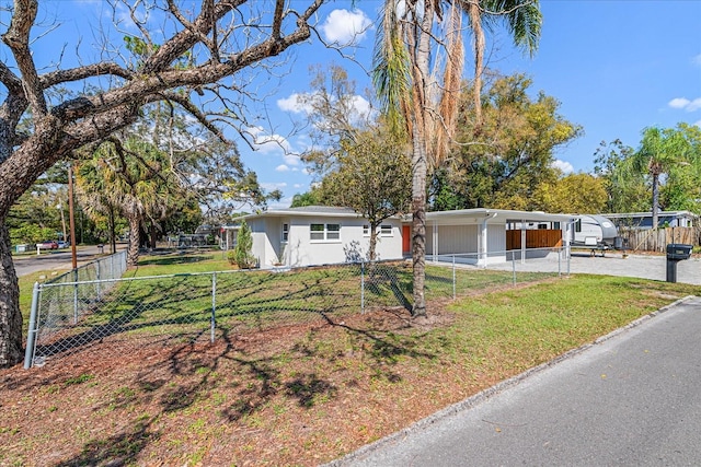 view of front of home with a fenced front yard and a front yard