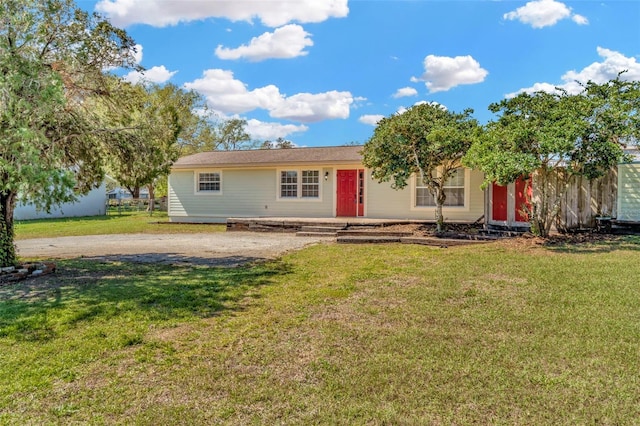 single story home with a front yard