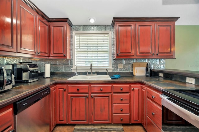 kitchen with dark brown cabinets, stainless steel appliances, and a sink