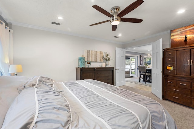 bedroom with recessed lighting, visible vents, crown molding, and light colored carpet