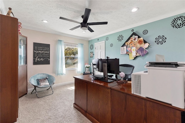 office space with ornamental molding, light carpet, a textured ceiling, and a ceiling fan