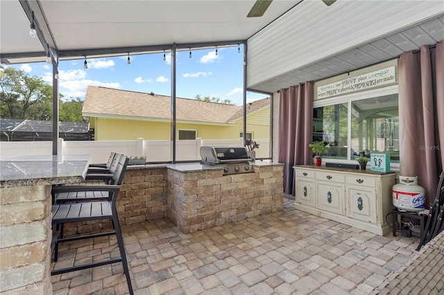 view of patio / terrace featuring a grill and an outdoor kitchen