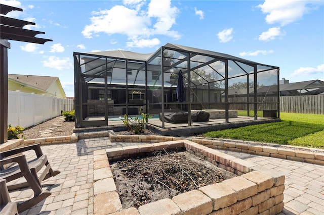 view of patio featuring a pool, a lanai, and a fenced backyard