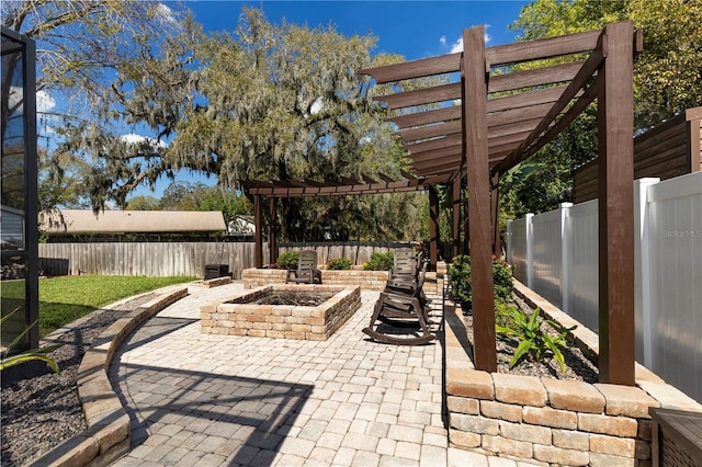 view of patio / terrace featuring an outdoor fire pit, a fenced backyard, and a pergola