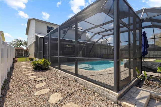 view of pool with a fenced in pool, a patio area, a fenced backyard, and a lanai