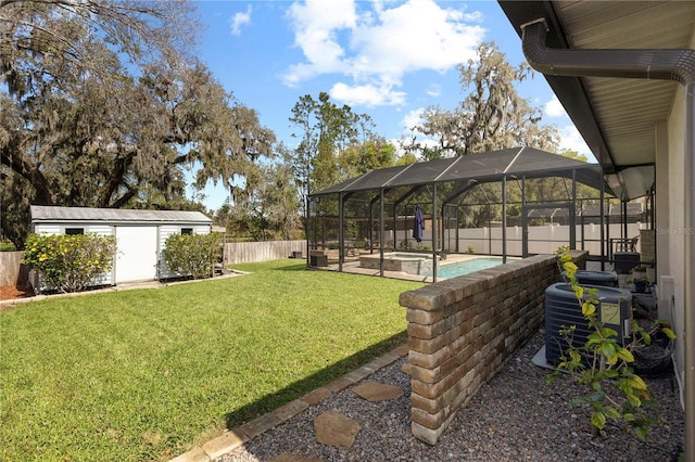 view of yard featuring an outbuilding, glass enclosure, central AC unit, a fenced backyard, and a fenced in pool