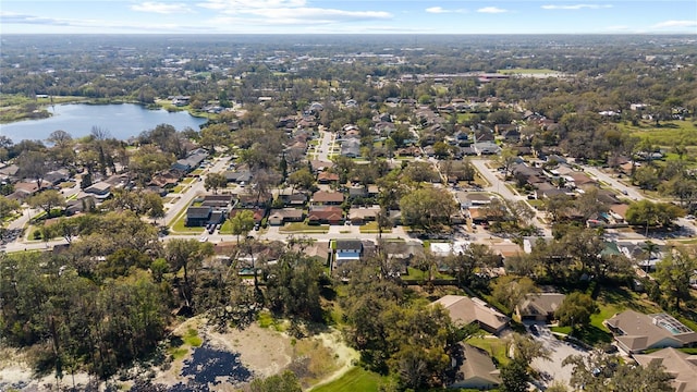 drone / aerial view featuring a residential view and a water view