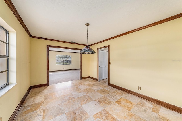 unfurnished dining area featuring visible vents, baseboards, and crown molding