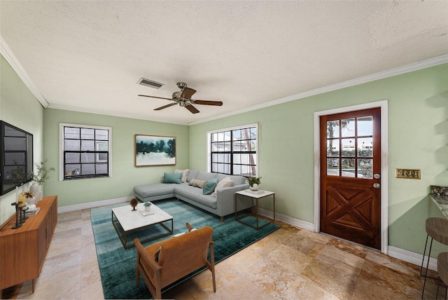 living room featuring baseboards, crown molding, visible vents, and a wealth of natural light