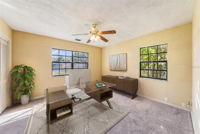 sitting room with baseboards, ceiling fan, visible vents, and carpet flooring