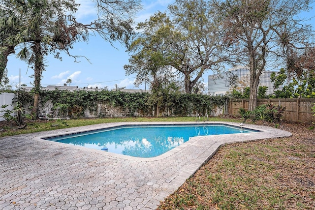 view of pool with a fenced backyard, a fenced in pool, and a patio