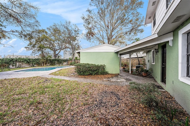 view of yard with a patio area, a fenced backyard, and a fenced in pool