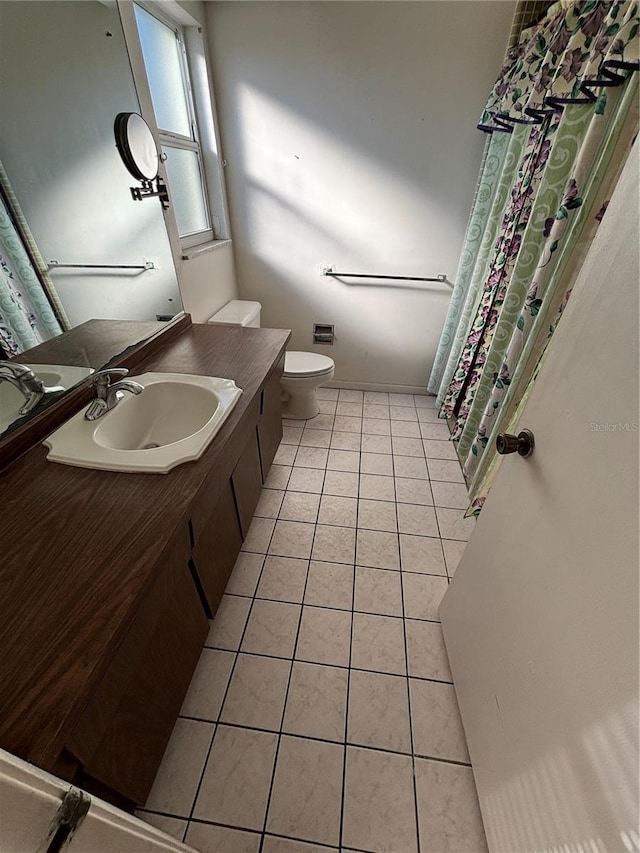 full bathroom featuring vanity, toilet, and tile patterned floors