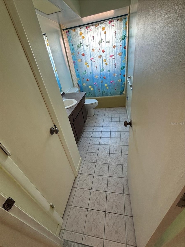 full bathroom with shower / bath combination with curtain, tile patterned flooring, vanity, and toilet