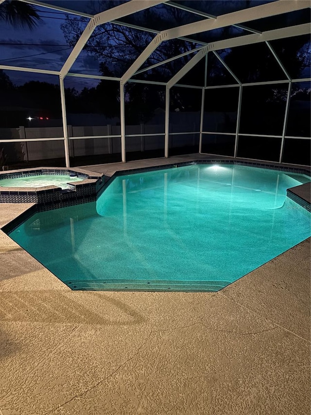 view of pool featuring a pool with connected hot tub and a patio