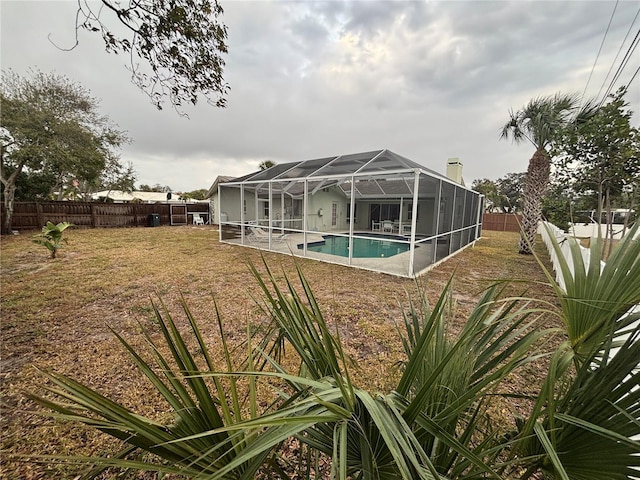 view of swimming pool with a lanai, a fenced backyard, and a fenced in pool