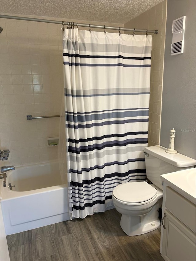 bathroom featuring shower / bath combo, visible vents, toilet, wood finished floors, and a textured ceiling