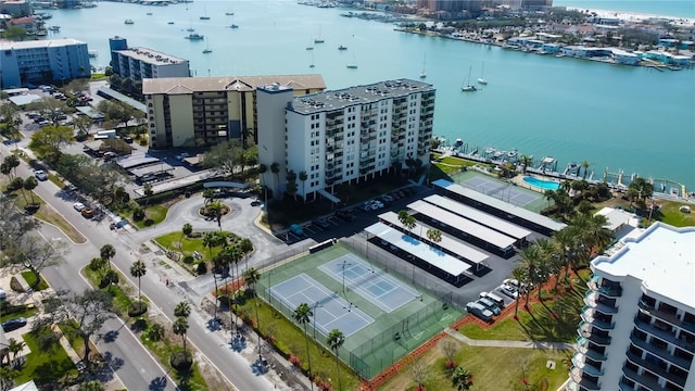 birds eye view of property with a view of city and a water view