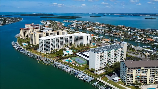 drone / aerial view featuring a water view and a city view