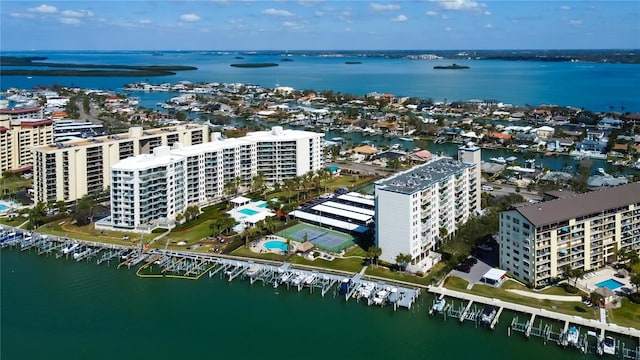 birds eye view of property featuring a water view and a city view