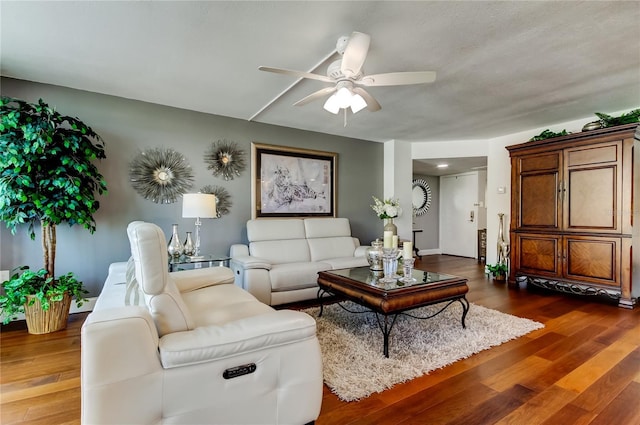 living area featuring wood finished floors and a ceiling fan