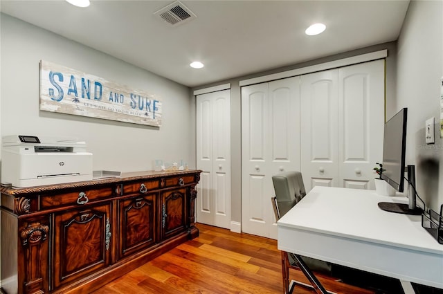 office area featuring light wood-style floors, visible vents, and recessed lighting