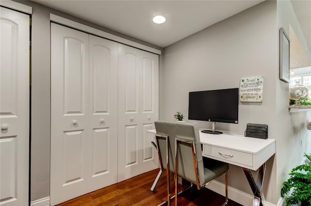 office space with dark wood finished floors